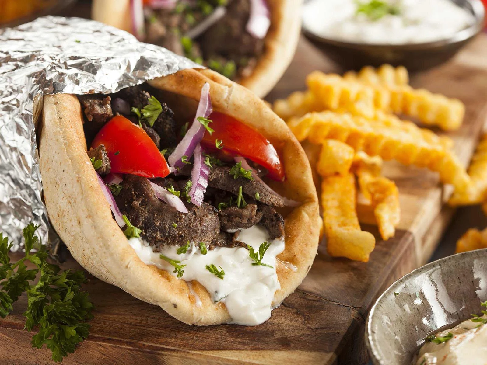 A shawarma wrap with chips
