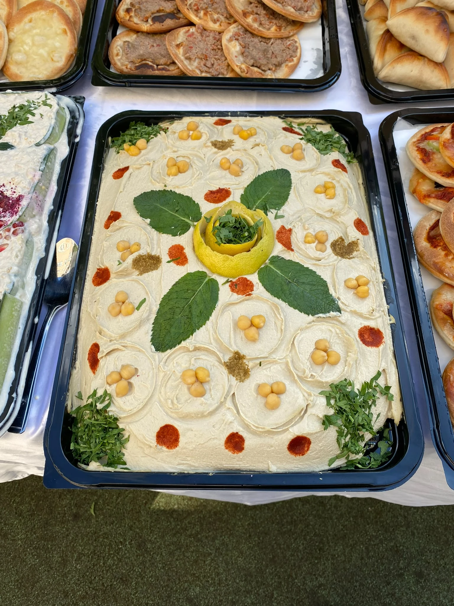 A large hummus catering tray